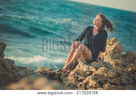 Hot Sexy Stylish Dressed Young Lady Brunette Hairs And Pinky Cheeks With Open Legs Shoulders And Arm