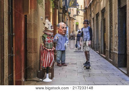 BARCELONA, SPAIN - MAY 11, 2017: This is a scene with unidentified passers-by on one of the streets of the Gothic Quarter.