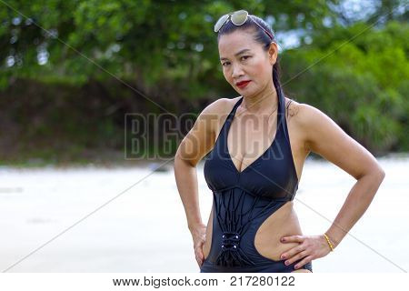 Woman black bikini show body sexy on beach at Ban Krut Beach Prachuap Khirikhan Province Thailand