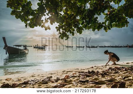 long tailed boat fishing boat motor boat with the sunrays