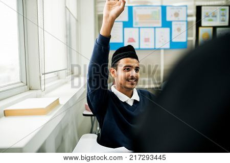 Young muslim student in class