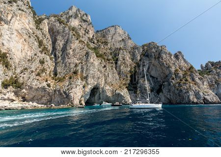 CAPRI ITALY - JUNE 13 2017: Boats with tourists near Grotta Bianca and Grotta Meravigliosa Capri Italy