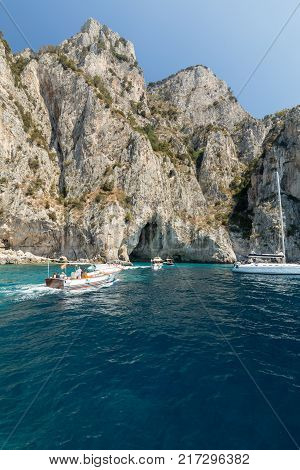 CAPRI ITALY - JUNE 13 2017: Boats with tourists near Grotta Bianca and Grotta Meravigliosa Capri Italy
