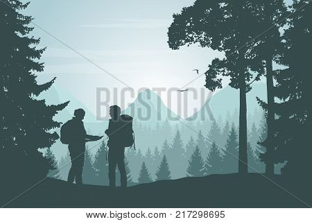 Two tourists walking through a mountain landscape with a forest looking for a path in the map under a winter sky with dawn - vector