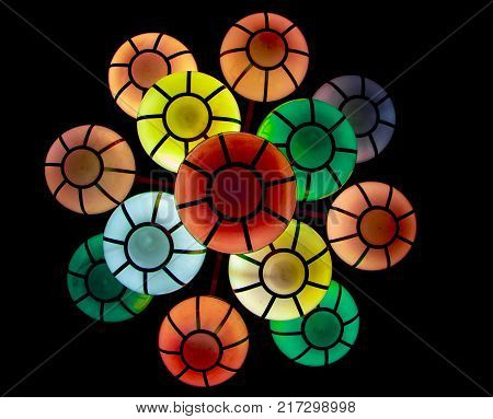 The street lamp in the form of bunches of different colors of round form.