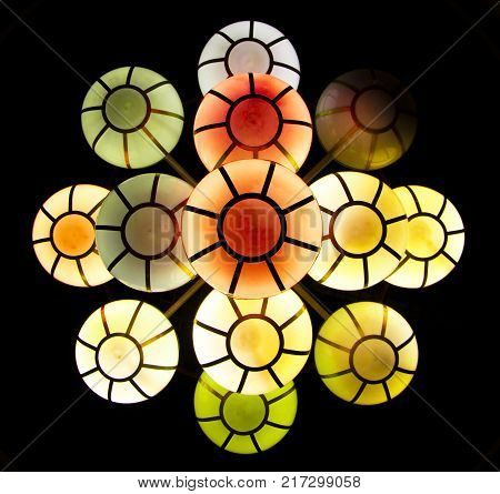 The street lamp in the form of bunches of different colors of round form.