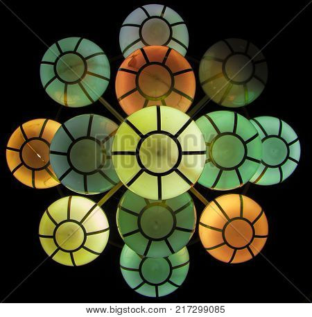 The street lamp in the form of bunches of different colors of round form.