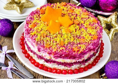 Herring under fur coat. Shuba salad. Russian layered salad with beet potato carrot egg pickled herring and mayonnaise for Christmas dinner