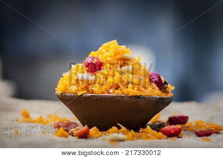 Indian Sweet Rice Dish In A Clay Bowl On Gunny Background.