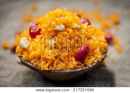 Indian Sweet Rice Dish In A Clay Bowl On Gunny Background.