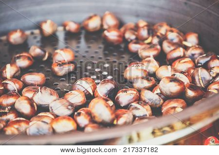 Bunch of roasted chestnuts at street wendor