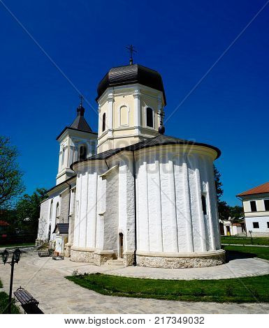 Exterior view to stone summer Dormition church at orthodox Capriana monastery at Moldova