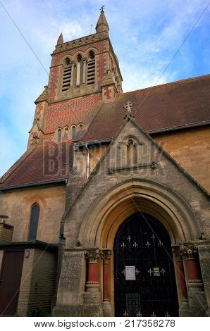 Bracknell, England - Dec 08, 2017: Porch entrance and bell tower of St Michael's church which represents the Church of England in the town of Bracknell, United Kingdom