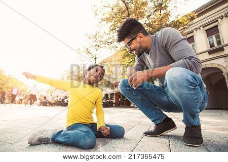 Happy father spending time with their daughter having fun