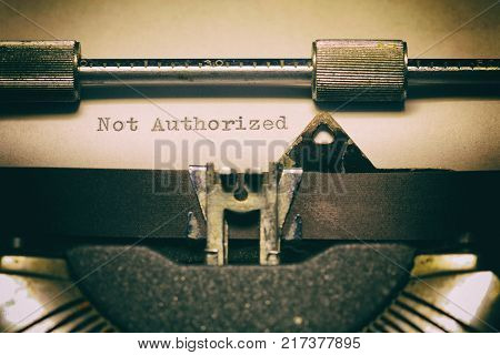 Old typewriter with the written word Unauthorized