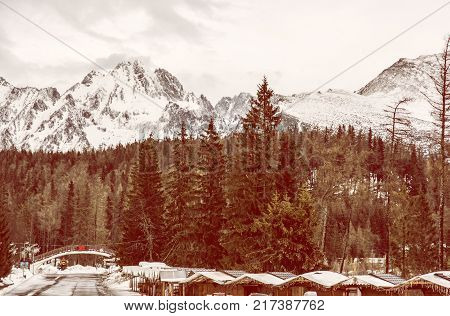 Strbske pleso area center of winter sports High Tatras Slovak republic. Travel destination. Red photo filter.