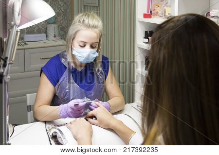 Cute Girl Master Doing A Manicure.