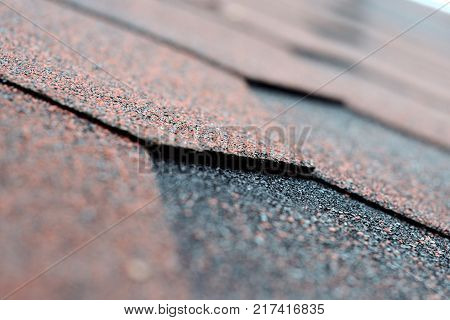 Bituminous shingles coatings for use in garages, cottages and private homes