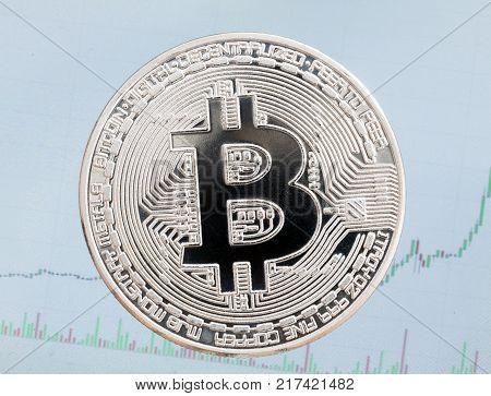 Silver bitcoin isolated  on blue background. High resolution photo.