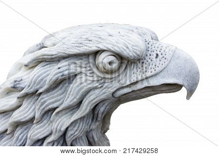 Eagle carved from white marble. Isolated on white close-up