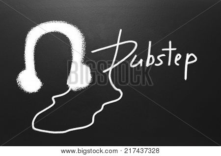 Dubstep text and Drawn witch chalk earphones on blackboard