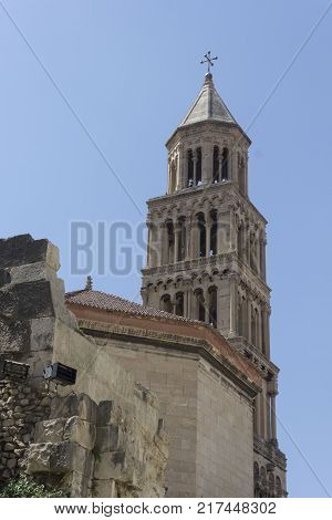 SPLIT, CROATIA - AUGUST 11 2017: Bell tower of Saint Domnius cathedral in Split with fortified city walls