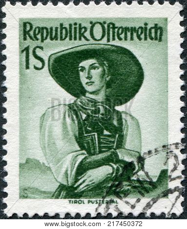 AUSTRIA - CIRCA 1951: A stamp printed in Austria shows a woman in national dress Tyrol Puster Valley circa 1951