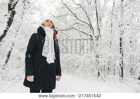 Beautiful Young Girl In A White Winter Forest