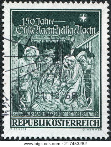 AUSTRIA - CIRCA 1968: A stamp printed in Austria devoted to 150th anniversary of the Memorial Chapel Oberndorf-Salzburg is shown Hymn 