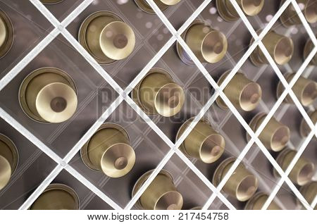 Single-serve coffee containers or coffee capsules. Net shaped sales stand. Closeup