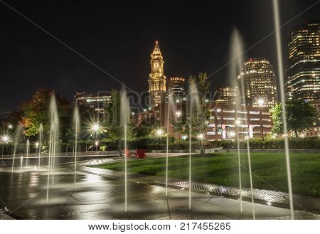 Fountains and Boston Skyline in outdoor park at night