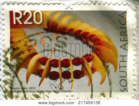 GOMEL, BELARUS, 5 DECEMBER 2017, Stamp printed in South Africa shows image of the Neckpiece of lions claws, Zulu, circa 2010. 
