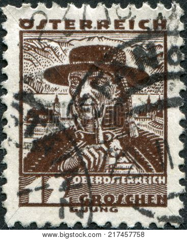 AUSTRIA - CIRCA 1934: A stamp printed in Austria shows a farmer from Traunkreis Lake Traunsee and Schloss Ort circa 1934