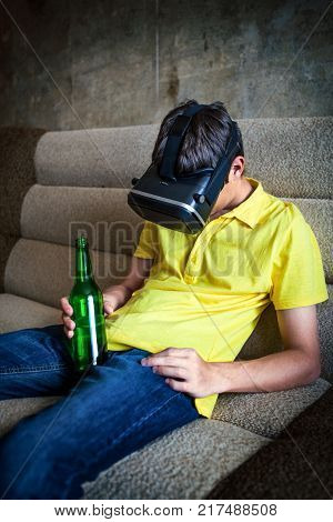 Young Man in VR Glasses with a Beer sleep on the Sofa