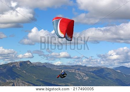 Paraglider flying above the Chabre mountain in France