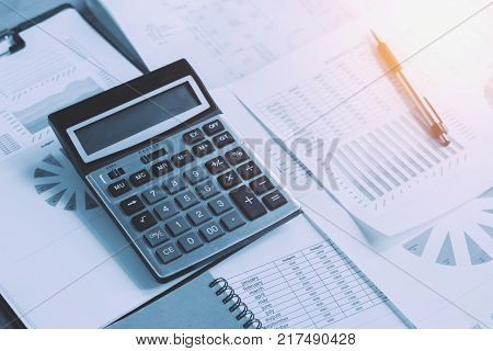 business accounting concept financial with calculator pen notbook on desk