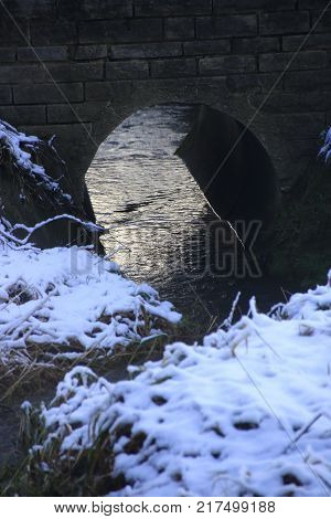 brick bridge over the strudelbach in the lower valley in the community Weissach