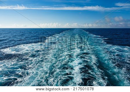 Backwash on the Atlantic Ocean and blue sky.