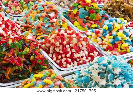 Assortment of jellied colored sweets as a product background