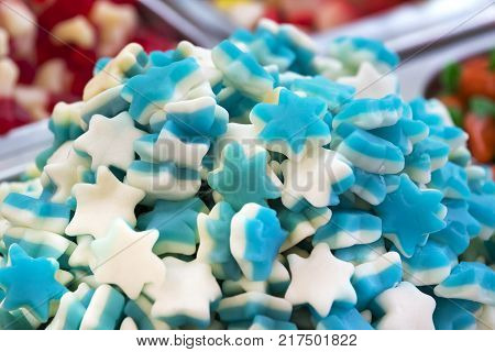 Assortment of jellied colored sweets as a product background