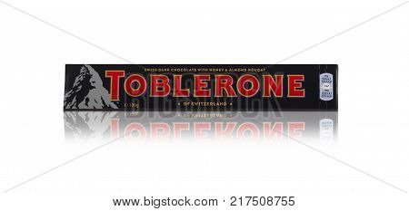 CHISINAU, MOLDOVA - December 9, 2017: Toblerone - Swiss milk chocolate with honey and almond nougat on a white background. With clipping path.