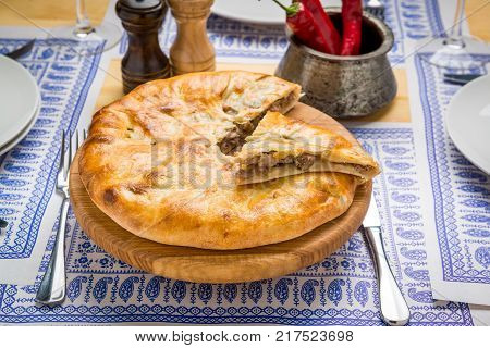 bakery product kubdari in Georgian, on the table
