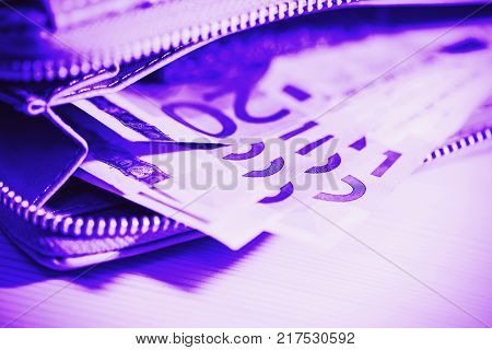 Euro banknotes in wallet. business finance investment saving and cash concept lose up of euro paper money