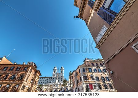 Via dei Condotti with Trinità dei Monti on the background. Rome Italy