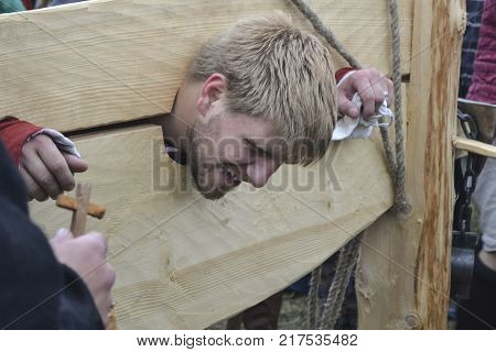 MOSCOW, RUSSIA - JUNE 22, 2013 : Park Kolomna. Festival of reconstruction Times and epochs. The staging of torture on the pillory