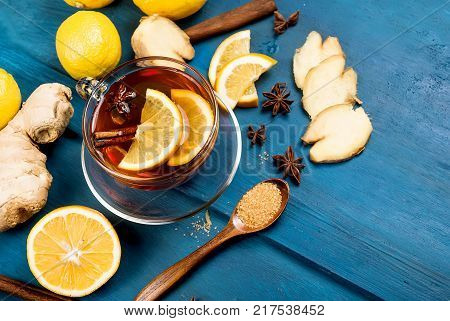 Cup Of Ginger Tea With Lemon And Honey On Dark Blue Background,