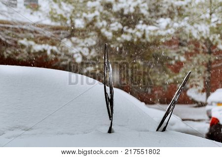 Windshield wiper of an snow covered car after heavy snowfall cars covered snow winter falls snow