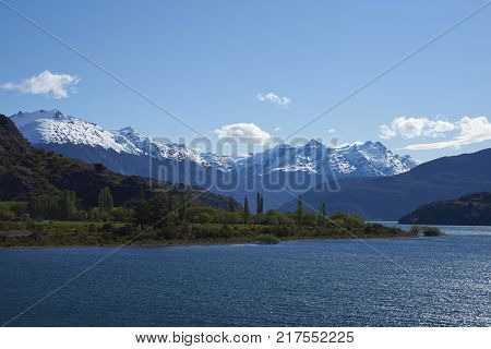Landscape along the Carretera Austral next to the azure blue waters of Lago Bertrand in Patagonia, Chile