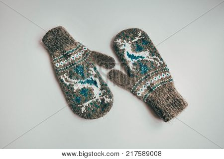 Stack Of Handmade Warm Knitted Socks Scarfs Mittens From Rough Wool Yarn Brown Beige Grey On Wood Ta