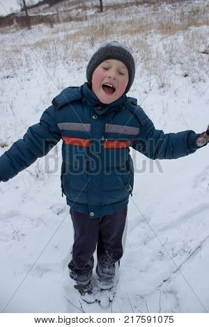 little boy enjoying in winter holidayboy screaming in winter